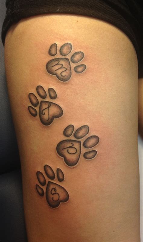 pawprint tattoo designs|paw print tattoo on thigh.